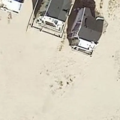 Several houses beside a beach