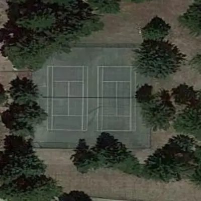 Tennis courts surrounded by trees